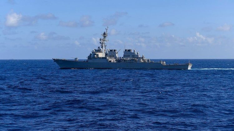 This handout photo from the US Navy taken on November 20, 2021 shows the US Navy's Arleigh Burke-class guided-missile destroyer USS Milius (DDG 69) sailing in the South China Sea. Credit: AFP